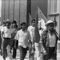 Cesar Chavez (center) marches with United Farm Workers members in Redondo Beach, California, July 9, 1975.