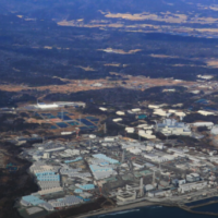 The Fukushima Daiichi nuclear power plant and surrounding areas of the exclusion zone, seen February 10. The town of Futaba is visible to the right of the plant, and Okuma to the left. The Yomiuri Shimbun via AP