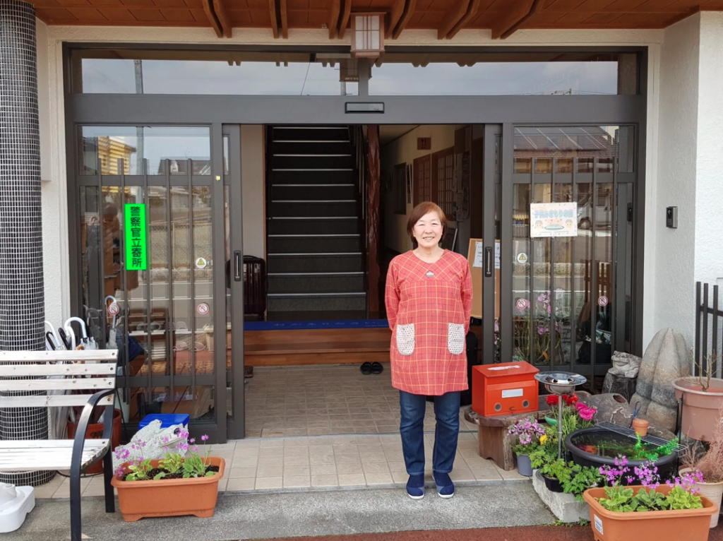 Tomoko Kobayashi in front of her ryokan in Odaka. Thomas A. Bass