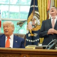 President Donald Trump (left) gets a reaction from Britian's ambassador to the United States Peter Mandelson (right), in the Oval Office of the White House, May 8, 2025, in Washington