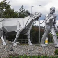 Farmer and cow sculpture, Clough