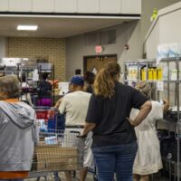People shop the shelves at the Ritenour Co-Care Food Pantry just outside of St. Louis last week. The nonprofit has seen rising need as grocery prices soar and thousands of Missourians lose federal food assistance. (Photo courtesy of Ritenour Co-Care Food Pantry)