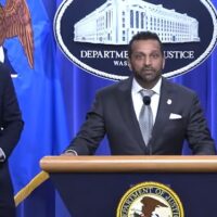 FBI Director Kash Patel (at lectern) and Acting U.S. Attorney General Todd Blanche announce charges against the Southern Poverty Law Center over its use of paid informants in extremist organizations on April 21, 2026 in Washington, D.C. (Screenshot via U.S. Department of Justice)