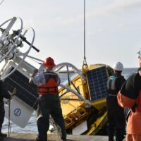 Recovering a large Coastal Surface Mooring buoy. (Photo from work supported by the US National Science Foundation Ocean Observatories Initiative. Copyright Andrew Reed/WHOI)