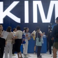 Visitors at the booth for Moonshot's Kimi K3 during World AI Conference in Shanghai, Friday, July 17, 2026. [AP Photo/Ng Han Guan]