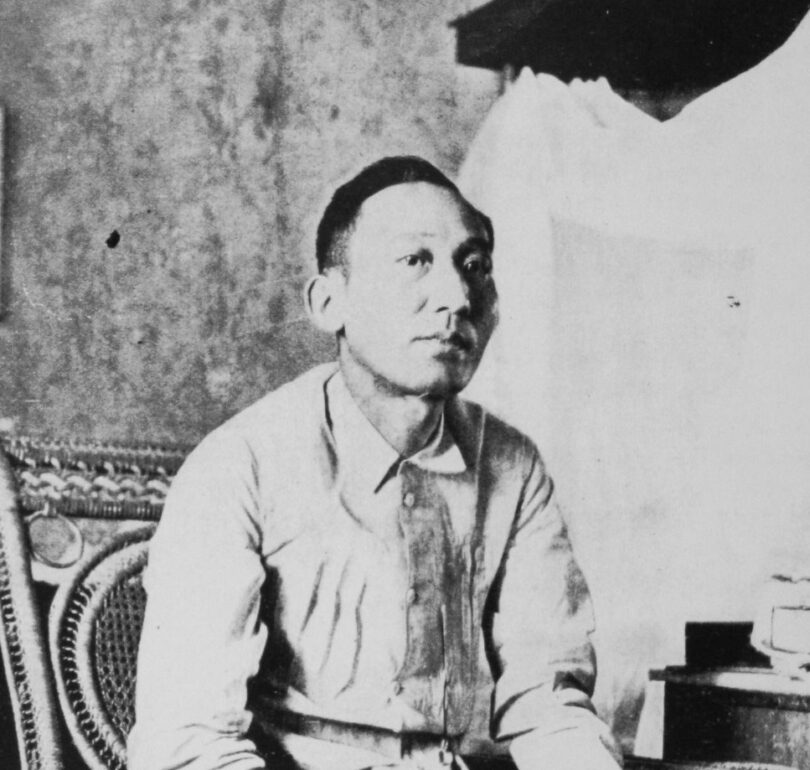 A black and white photo of Apolinario Mabini sitting in a chiar.
