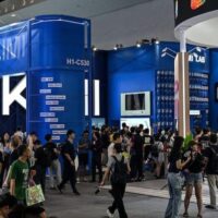 Visitors gather at Moonshot AI’s Kimi exhibit during the World Artificial Intelligence Conference in Shanghai. China’s open-weight models are challenging the monopoly profits built into Wall Street’s AI boom.