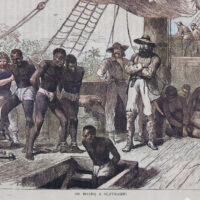 A 19thcentury engraving showing enslaved African men being forcibly led into the hold of a ship by European crew members.