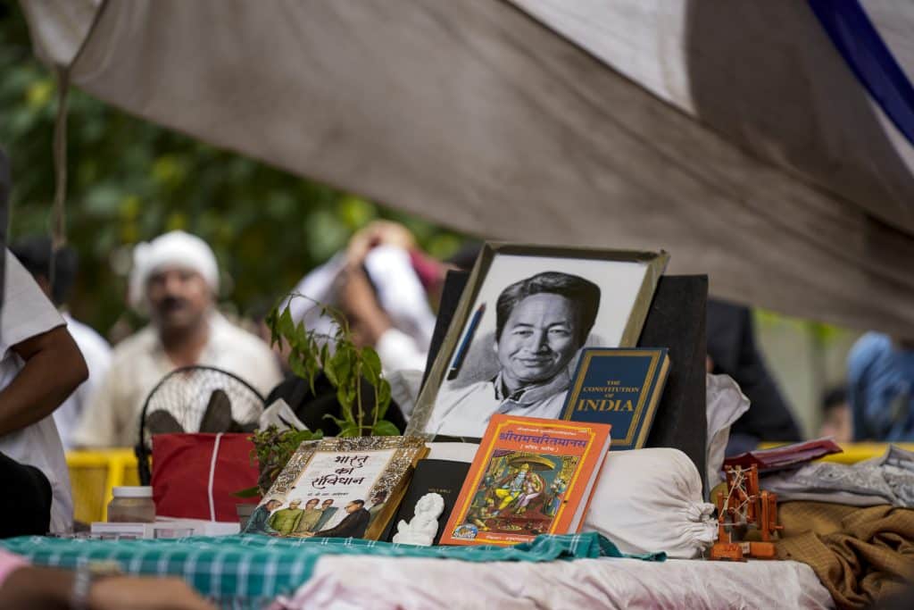 A portrait of activist Sonam Wangchuk and a copy of the Constitution of India and the Ramcharitmanas displayed at Jantar Mantar during an ongoing demonstration, in New Delhi, Tuesday, July 21, 2026. Photo: PTI/Salman Ali.
