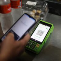 A shopper pays with Pix at a store in Rio de Janeiro. Brazil’s public instant-payment system cuts Visa and Mastercard out of millions of transactions. Washington has imposed tariffs in an attempt to protect the U.S. payment monopolies.