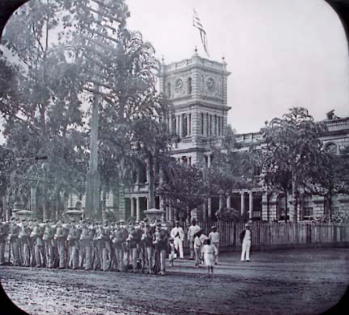 Scene of Queen Lili’uokalani’s abdication following planters’ coup in 1893. [Source: archives.starbulletin.com]