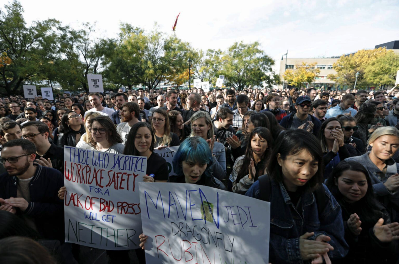 Google workers hold signs during a global company walkout at Jackson Square Park in New York City, on Nov. 1, 2018. The walkout followed a New York Times report that former Google executives like Andy Rubin received multi-million dollar severance packages after being accused of sexual misconduct, adding to ongoing protests of Google’s work for the Pentagon—including the Project Maven AI system and JEDI cloud data programs featured on the sign at front. Peter Foley/Bloomberg via Getty Images