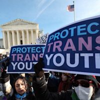 Supporters of trans youth outside the Supreme Court, in Washington, D.C., as the justices heard arguments in the school sports cases.