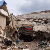 A Venezuelan flag hangs surrounded by debris, in the aftermath of the June 24 earthquakes, in Caraballeda, La Guaira state, Venezuela, July 9, 2026. Photo: Leonardo Fernandez Viloria/Reuters.