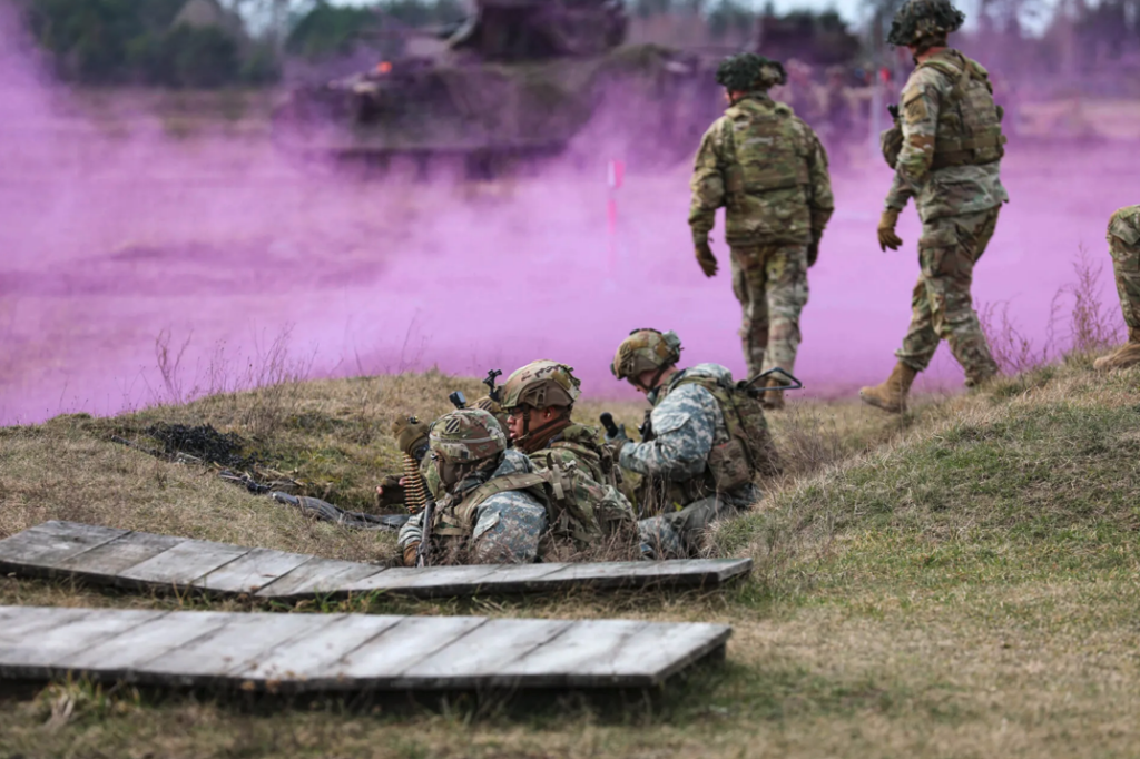 Soldiers provide security during Dragon 24, a NATO training event, at Bemowo Piskie Training Area, Poland, in March 2024. The exercise highlights NATO’s allied military cooperation and movement capabilities. (U.S. Army photo by Spc. Brett Thompson)