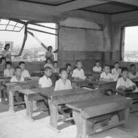 Students attend classes on July 27, 1946 with the ruins of Hiroshima surrounding them. (Bettmann / Getty Images)