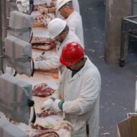 Workers on the meatpacking assembly line. | Photo courtesy of UFCW