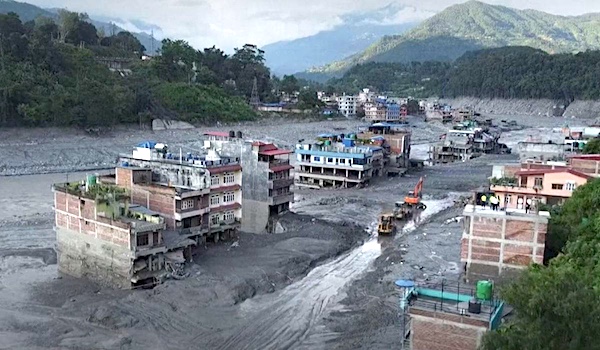 Screen grab of a drone footage from Reuters news agency shows excavators clearing mud in Nuwakot, Nepal. Source: BBC- Reuters / Fair use