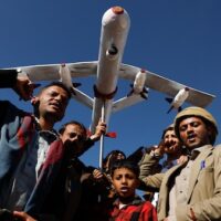 Supporters of Ansar Allah hold a mock drone drone during a rally against the U.S.-led strikes on Yemen and Israel’s war in Gaza Strip, in Sanaa, Yemen, Feb. 23, 2024. Photo: Osamah Abdulrahman/AP.