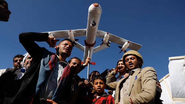 Supporters of Ansar Allah hold a mock drone drone during a rally against the U.S.-led strikes on Yemen and Israel’s war in Gaza Strip, in Sanaa, Yemen, Feb. 23, 2024. Photo: Osamah Abdulrahman/AP.