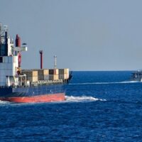 Merchant vessel being escorted through the Strait of Hormuz in 2019. Photo: U.S. Navy/Michael H. Lehman