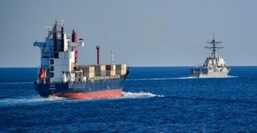 Merchant vessel being escorted through the Strait of Hormuz in 2019. Photo: U.S. Navy/Michael H. Lehman