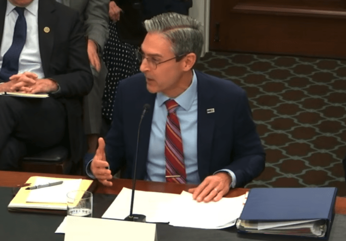 NED President Damon Wilson speaking before Congress in February 2026 when he bragged about NED’s role in sparking unrest in Iran that set the groundwork for an illegal U.S.-Israeli invasion that killed thousands of people. [Source: thegrayzone.com]