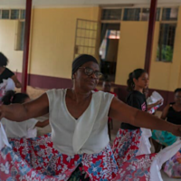 Jeanine Sadrien, 69, in a rehearsal of traditional folk dancing and drumming at community center in Port Louis. [Source: nytimes.com]