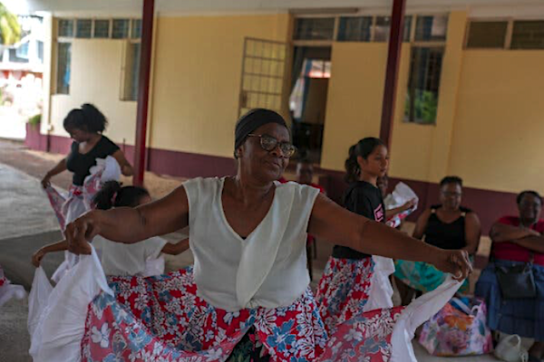 Jeanine Sadrien, 69, in a rehearsal of traditional folk dancing and drumming at community center in Port Louis. [Source: nytimes.com]