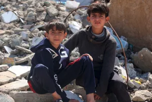 Palestinian children in the rubble of their community, foto: UN