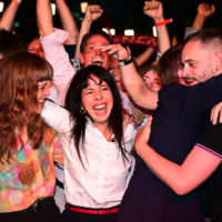 Deputy chair of the Die Linke parliamentary caucus Elif Eralp reacts to the first election projections alongside supporters and party members at an election in Berlin, September 20, 2026