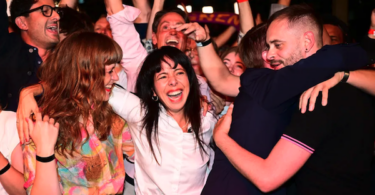 Deputy chair of the Die Linke parliamentary caucus Elif Eralp reacts to the first election projections alongside supporters and party members at an election in Berlin, September 20, 2026
