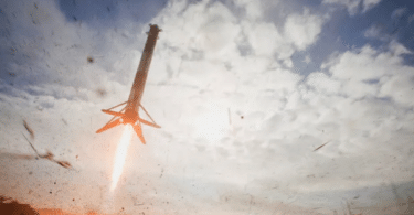 A SpaceX Falcon Heavy rocket booster descends to landing after launch with a classified payload for the US Space Force at Cape Canaveral, Florida, the United States, November 1, 2022 [Joe Skipper/Reuters]