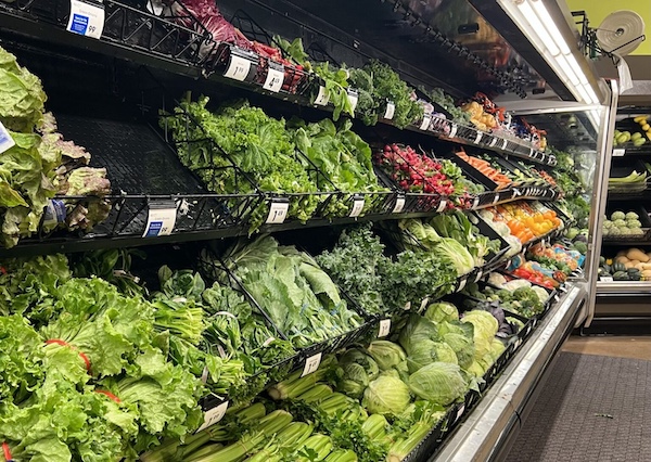 Vegetables and lettuces at a grocery store in Michigan. A summer of food recalls, including the record-shattering cyclosporiasis outbreak tied to iceberg lettuce that has sickened thousands, has raised many Americans’ fears of contracting a foodborne illness. (Photo by Jon King/Michigan Advance)