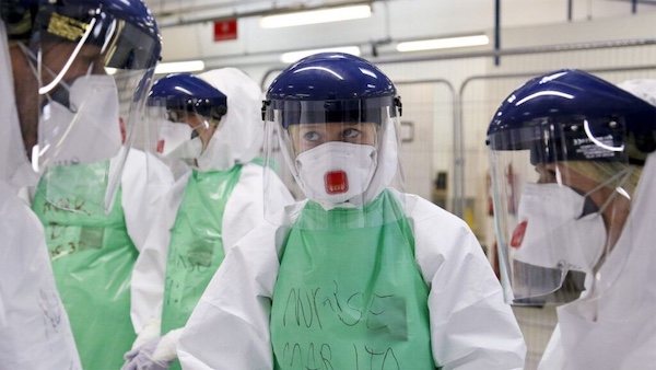 The ability to rapidly respond to disease outbreaks may deter biological attacks. Pictured: UK National Health Service medical workers prepare to fight an Ebola outbreak in Sierra Leone in 2014. Credit: DFID - UK Department for International Development via Wikimedia Commons. CC BY 2.0.