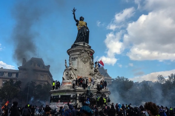 A yellow vest placed by protesters on the statue of Marianne on the Monument à la République in Paris reads, “2026: The police mutilates high schoolers.” CREDIT: Carl Court/Getty Images.