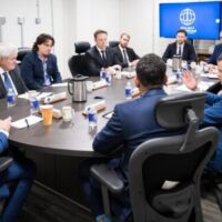 War profiteers Elon Musk and Palmer Luckey, with former House Speaker Newt Gingrich, at Marine Corps Base Quantico on Sept. 30, when Pete Hegseth named them to Project Meridian. Musk’s SpaceX and Luckey’s Anduril already make billions from Pentagon contracts.