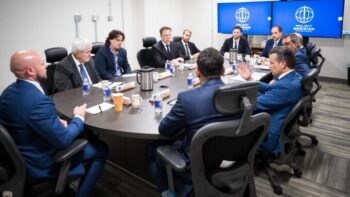 War profiteers Elon Musk and Palmer Luckey, with former House Speaker Newt Gingrich, at Marine Corps Base Quantico on Sept. 30, when Pete Hegseth named them to Project Meridian. Musk’s SpaceX and Luckey’s Anduril already make billions from Pentagon contracts.