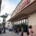 People wait in line outside CSL Plasma on May 25, 2021, in Brownsville, Texas.