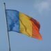 Romania National tricolor flag on clear Bucharest.