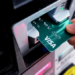 A customer uses a Visa credit card to pay for gasoline at a gas station in Mundelein, Ill., Feb. 8, 2024. [AP Photo/Nam Y. Huh]