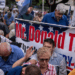 White South Africans rallying in support of President Trump outside the U.S. Embassy in Pretoria, South Africa, last month. Photo; Joao Silva/The New York Times