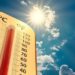climate change, low angle view Thermometer on blue sky with sun shining in summer show increase temperature, concept global warming
