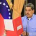 Venezuelan President Nicolás Maduro holding the draft of a decree regarding external unrest; the decree will protect Venezuela from US military aggression scenario. Miraflores Palace, Caracas, September 23, 2025. Photo: Venezuela's Presidential Press.