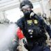 Federal agents, including members of the Department of Homeland Security, the Border Patrol, and police, clash with protesters outside a downtown US Immigration and Customs Enforcement (ICE) facility on October 4, 2025, in Portland, Oregon. The facility has become a focal point of nightly protests against the Trump administration and his announcement that he will be sending National Guard troops into Portland. (Photo by Spencer Platt/Getty Images)