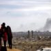 SMOKE RISES AS ISRAELI FORCES OPEN FIRE ON PALESTINIANS ATTEMPTING TO RETURN NORTH ON AL-RASHID STREET, OCTOBER 09, 2025. (PHOTO: OMAR ASHTAWY/APA IMAGES)